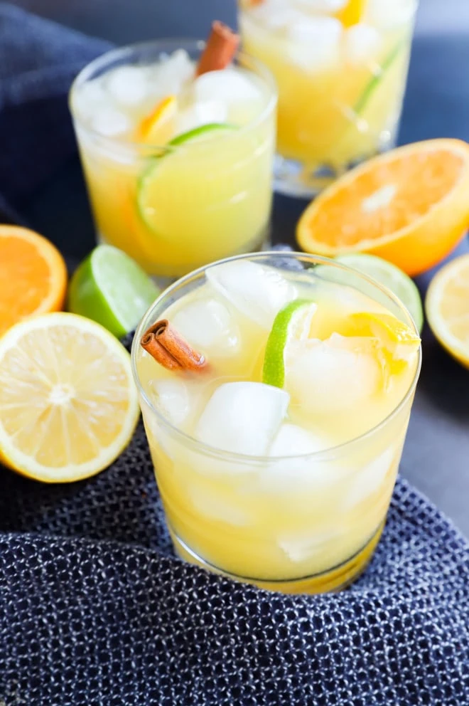 spiced rum punch in glasses with fresh citrus fruit