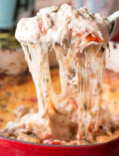 Spicy Lasagna Dip is packed with tomatoes, cheese, herbs and spicy Italian sausage. You won't miss the noodles at all! | cakenknife.com