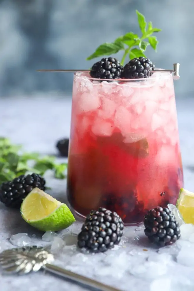White rum cocktail with blackberries image