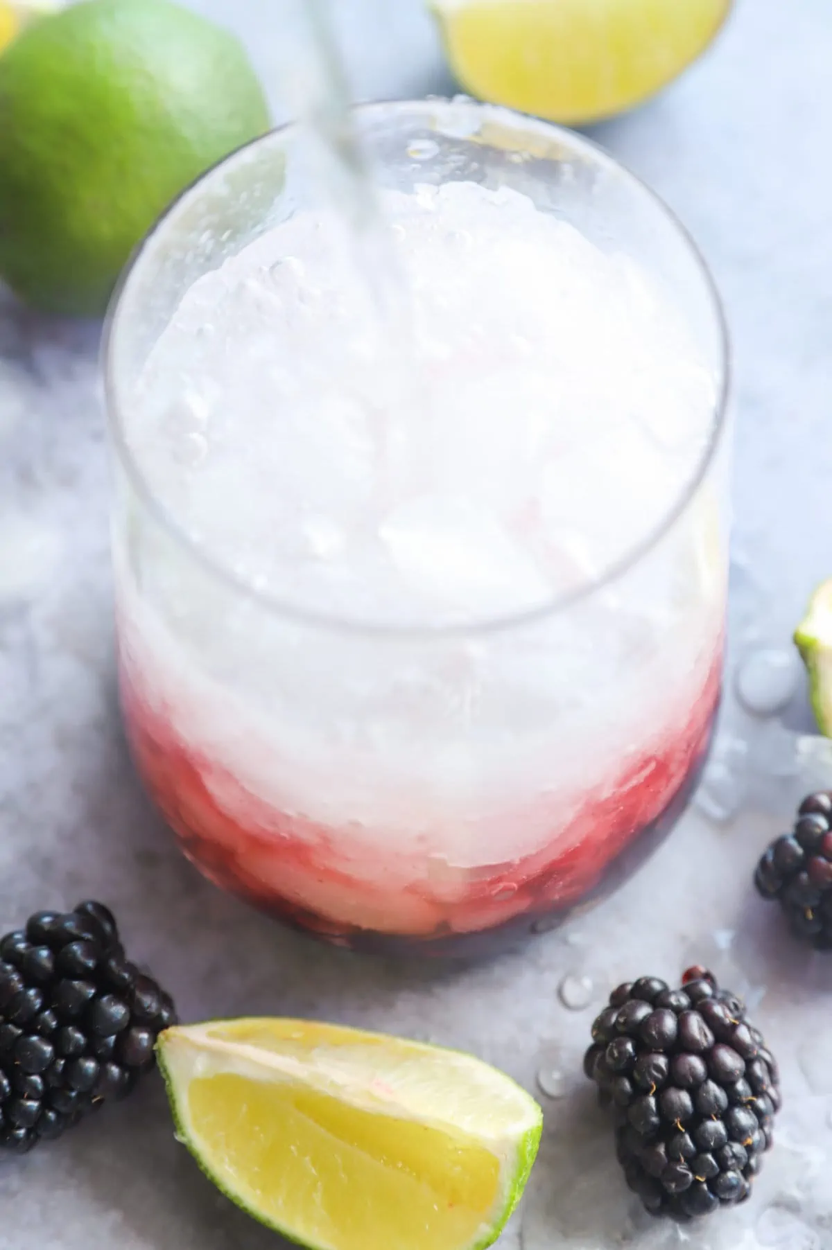 Pouring soda water into a cocktail