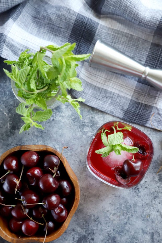 Whiskey smash cocktail photo overhead with cherries