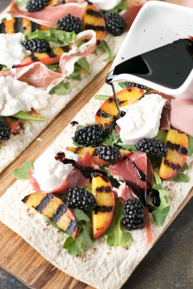 Grilled Peach Prosciutto Flatbread with Blackberry Balsamic Drizzle | cakenknife.com #flatoutflatbread #pizza #appetizer