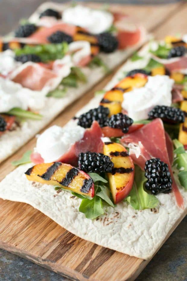 Grilled Peach Prosciutto Flatbread with Blackberry Balsamic Drizzle | cakenknife.com #flatoutflatbread #pizza #appetizer