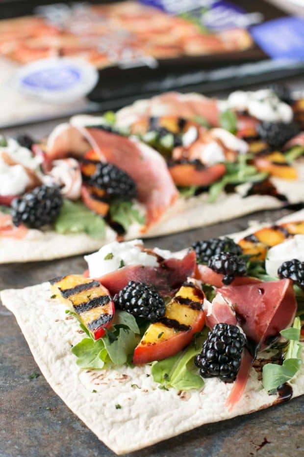 Grilled Peach Prosciutto Flatbread with Blackberry Balsamic Drizzle | cakenknife.com #flatoutflatbread #pizza #appetizer