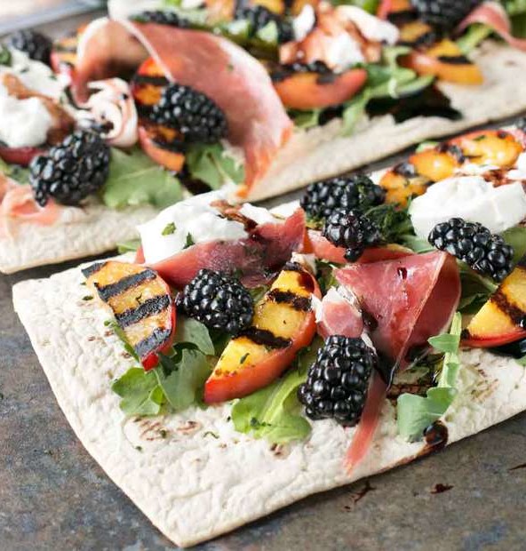 Grilled Peach Prosciutto Flatbread with Blackberry Balsamic Drizzle | cakenknife.com #flatoutflatbread #pizza #appetizer