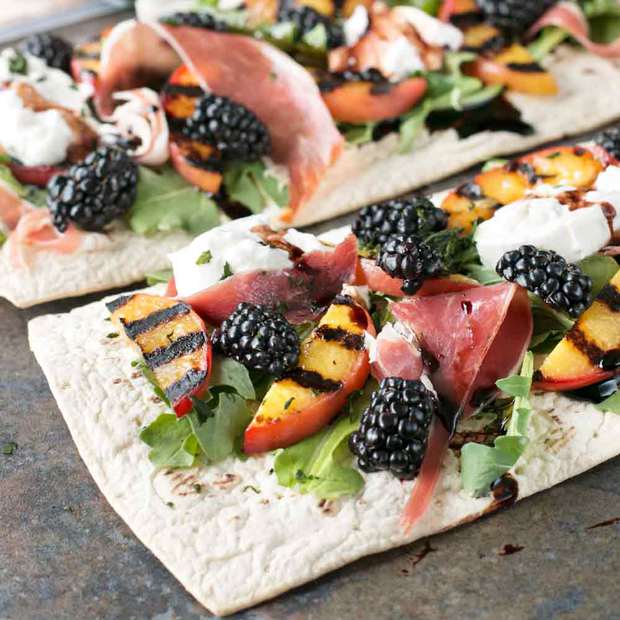 Grilled Peach Prosciutto Flatbread with Blackberry Balsamic Drizzle | cakenknife.com #flatoutflatbread #pizza #appetizer