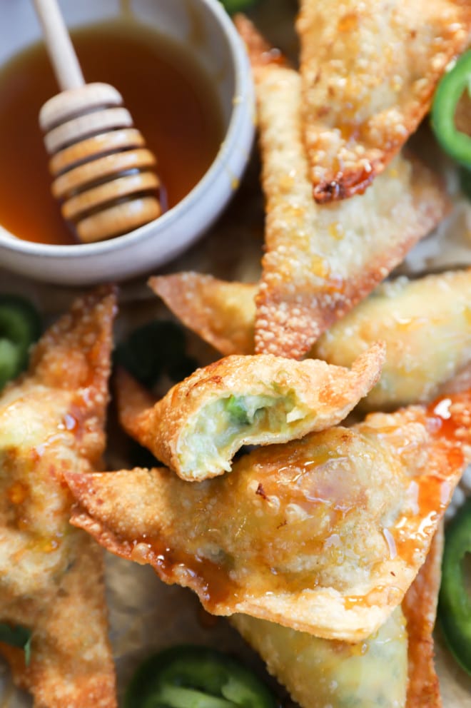 Jalapeno popper wontons in a pile on a platter