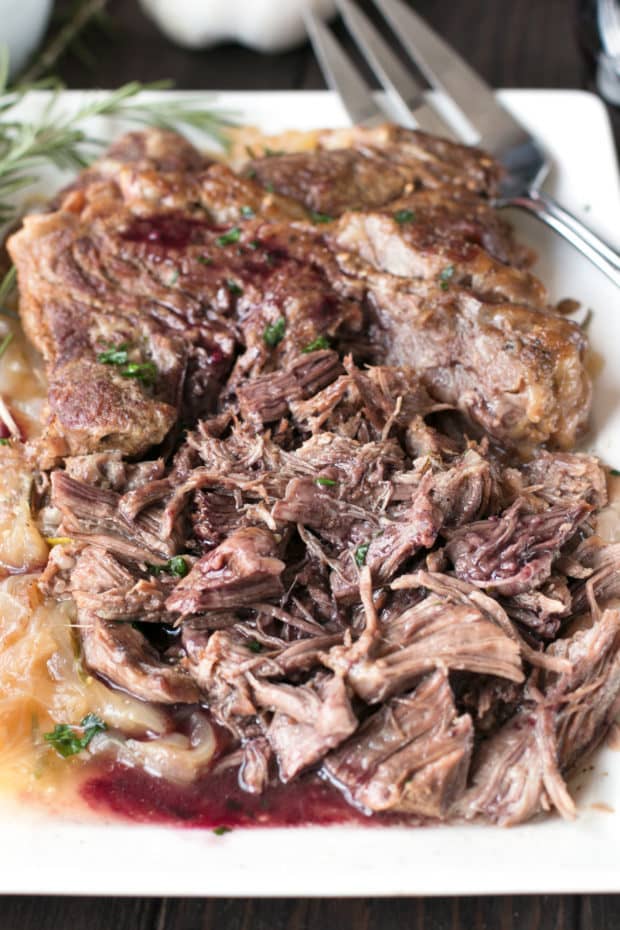 Slow Cooker Garlic Rosemary Pot Roast with Red Wine Sauce | cakenknife.com #ad #roastwiththemost #potroast #crockpot