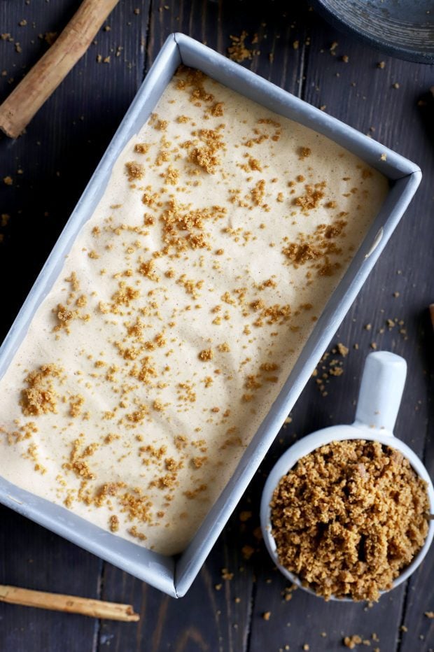 Pumpkin Spice Latte Ice Cream in a pan with Gingersnap Crumble on the side