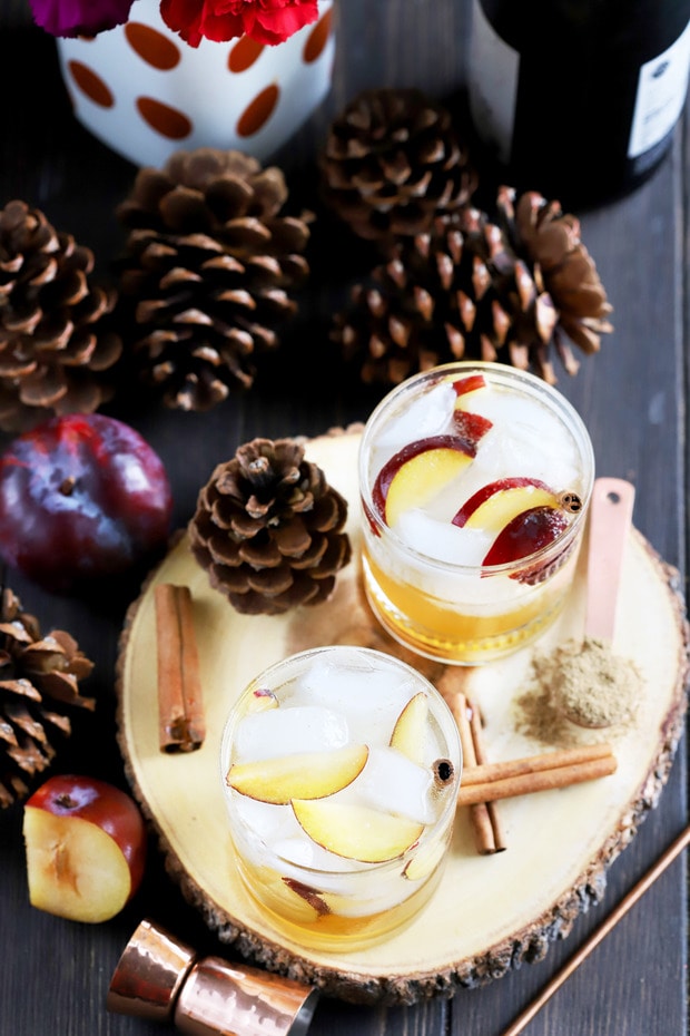 Aromatic Plum Smash 6 Full glass of Spiced Plum Smash Cocktail with plum slices and ice