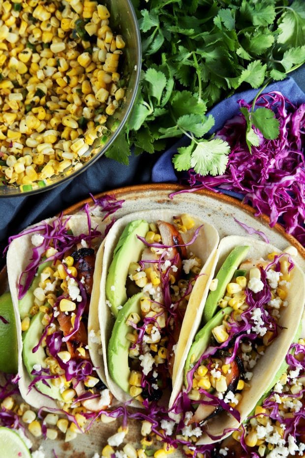 Charred Corn Chicken Avocado Tacos on a platter