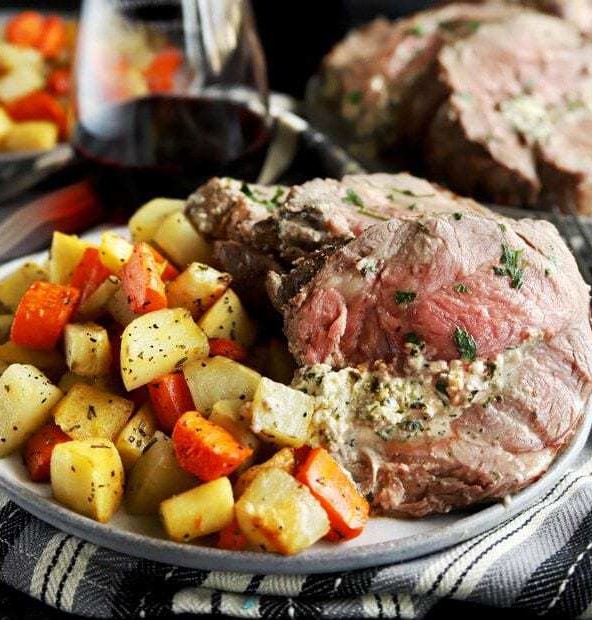 Herb goat cheese stuffed leg of lamb square photo