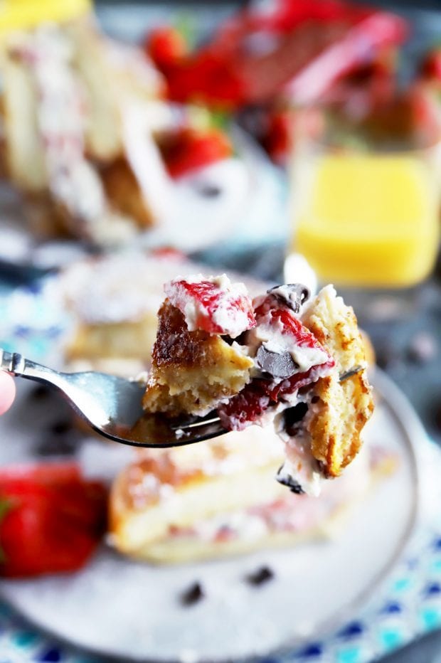 Fork full of breakfast with strawberries and chocolate