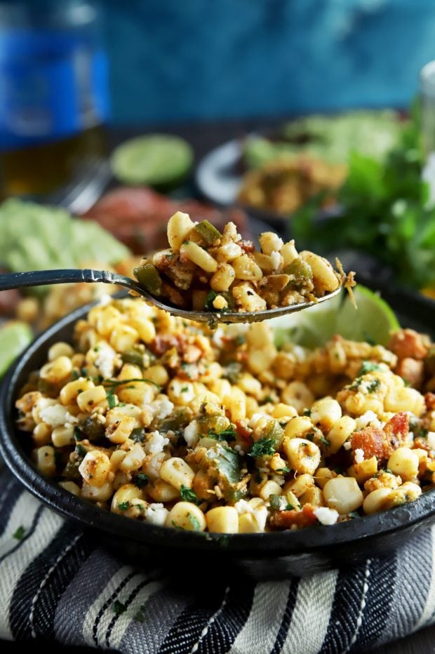 A spoonful of grilled corn salad