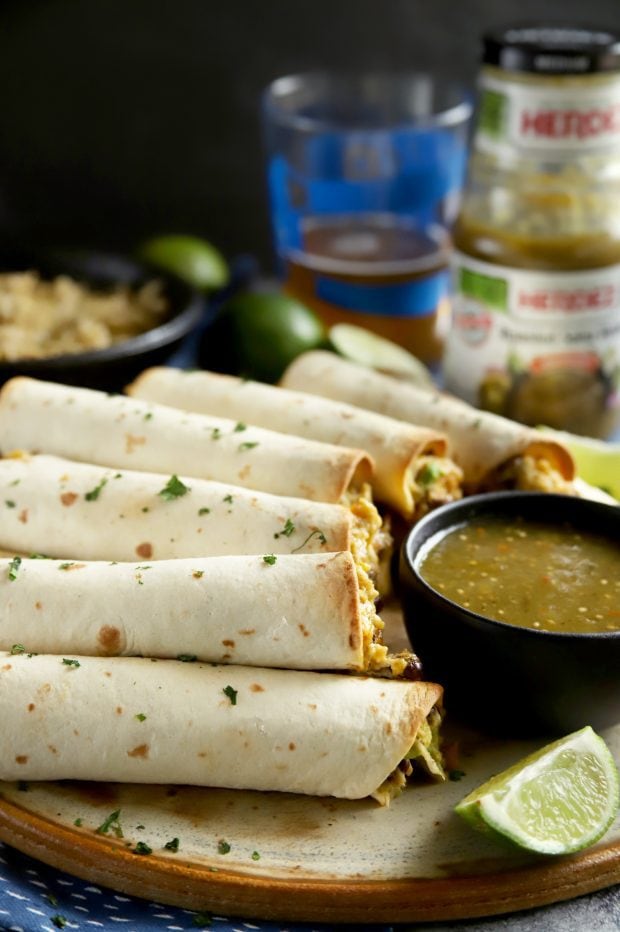 A platter of baked taquitos