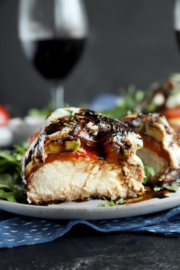 Avocado caprese chicken cut in half for dinner