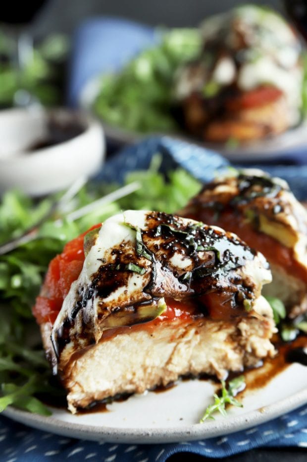 Caprese chicken cut in half