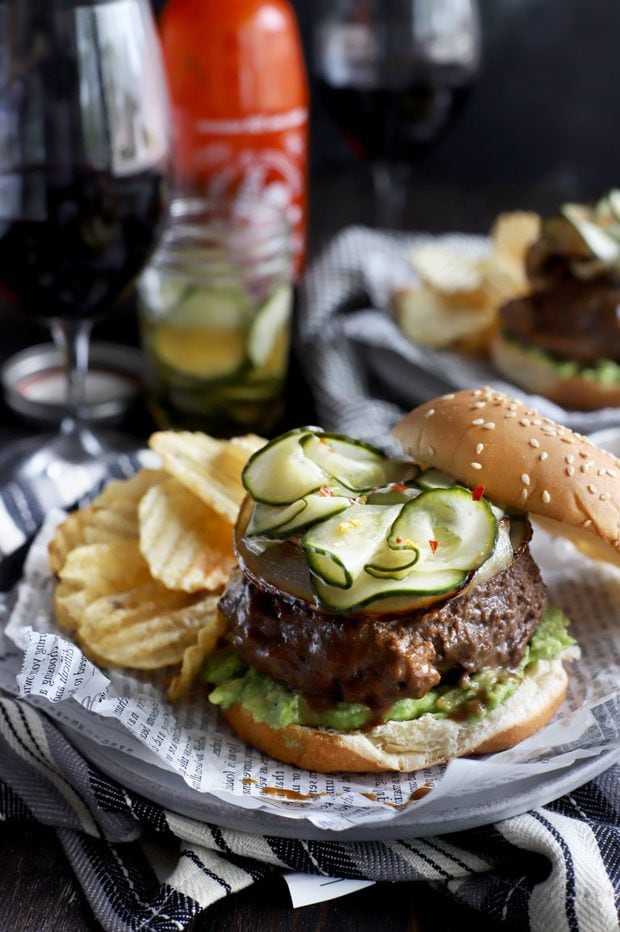 A miso glazed sriracha burger topped with pickles