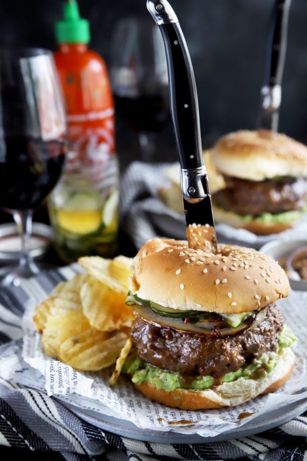 A grilled Asian inspired burger with a knife