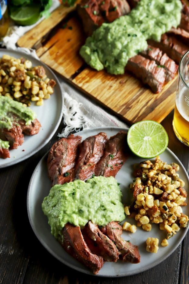 Steak dinner with avocado salsa and corn salad