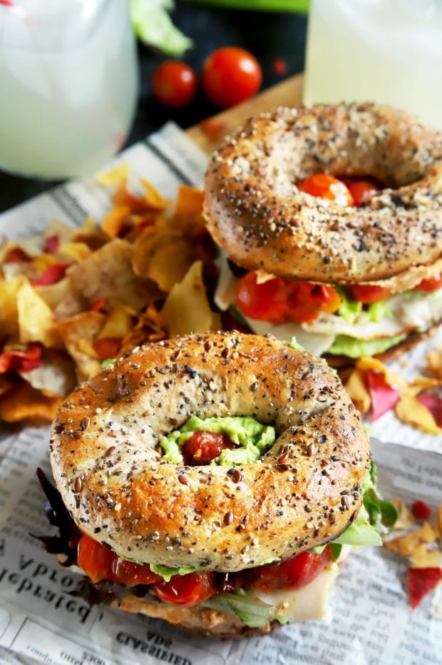 Bagel sandwiches with chips and veggies