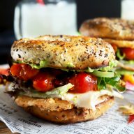 Stacked turkey bagel sandwich