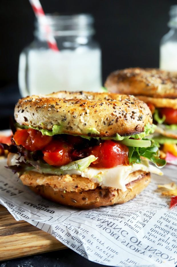 Stacked turkey bagel sandwich