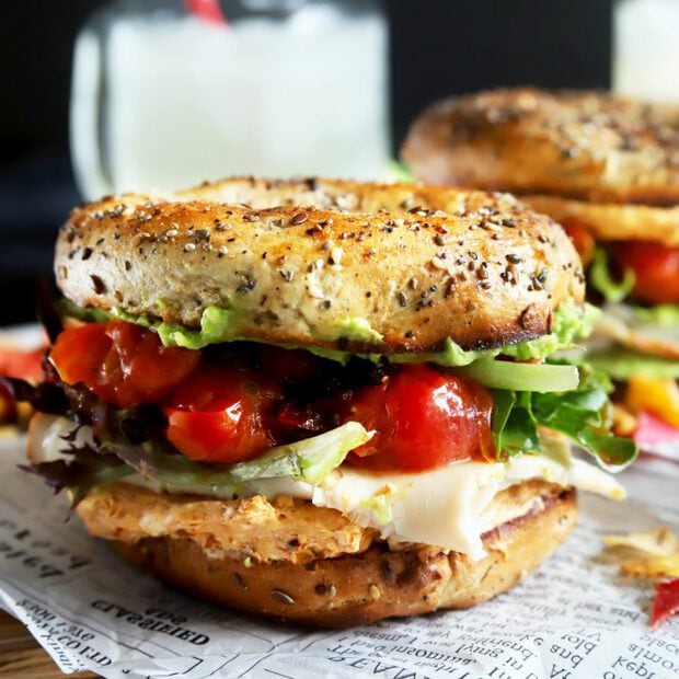 Stacked turkey bagel sandwich