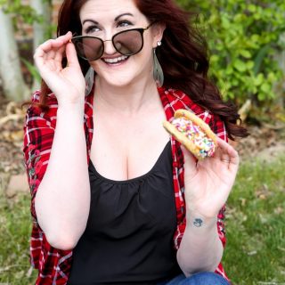 Woman holding an ice cream sandwich outside