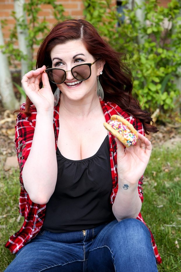 Woman holding an ice cream sandwich outside