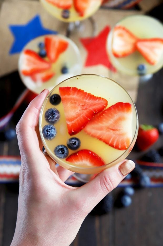 Hand holding a patriotic cocktail recipe