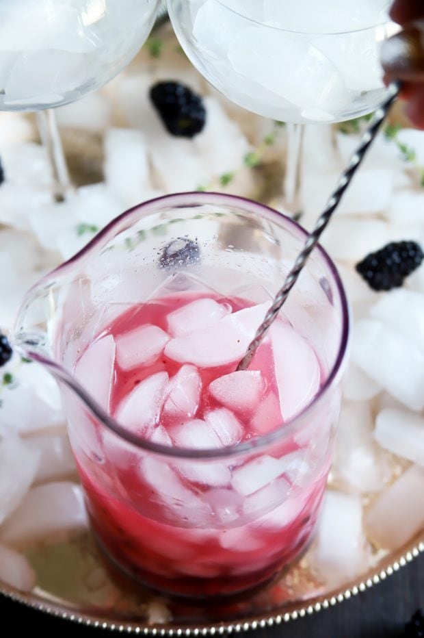 Making a fruity gin and tonic cocktail