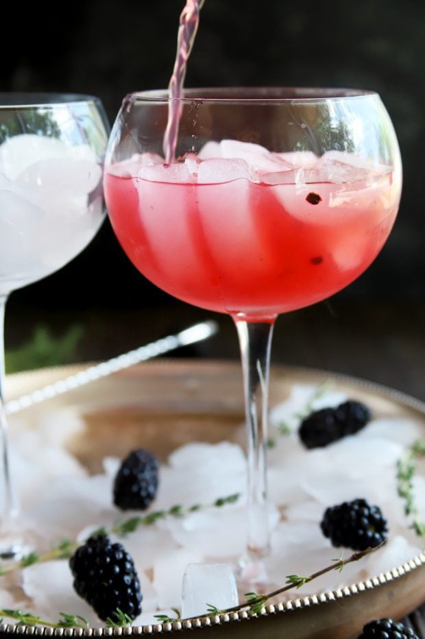 Pouring a blackberry gin and tonic