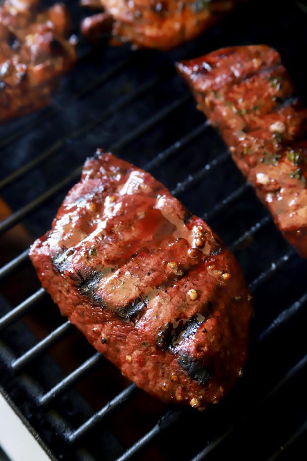 Grilling steak on the grill