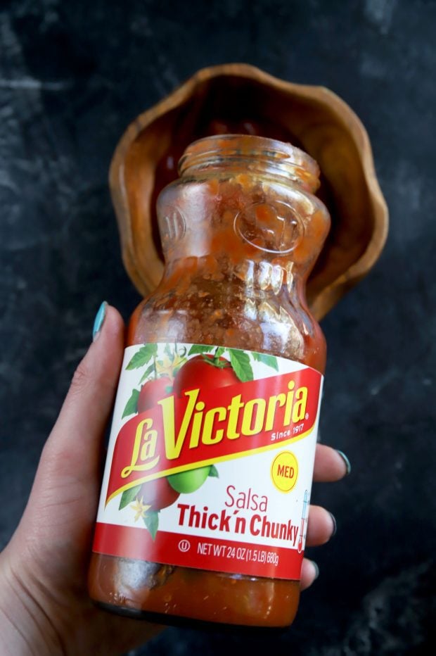 Pouring thick and chunky La Vitoria salsa