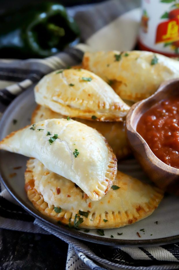 Golden chicken empanadas in a pile