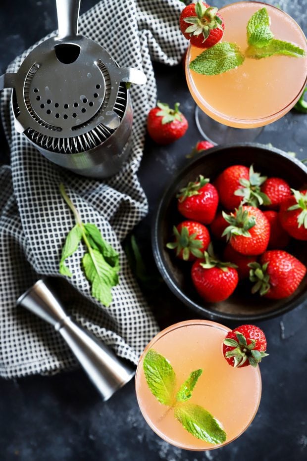 Overhead image of cocktails, berries, and mint