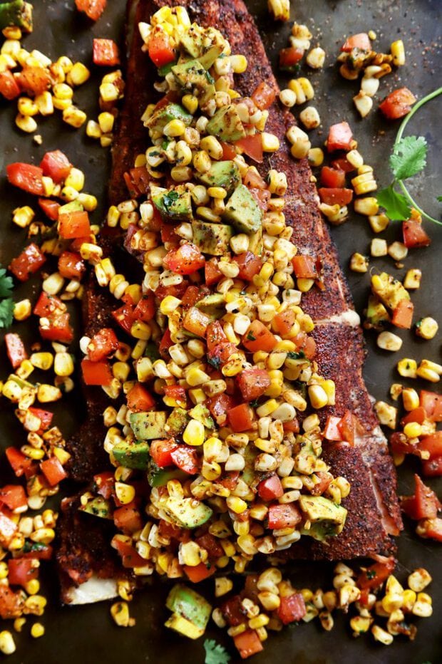 Overhead shot of grilled salmon with corn salsa