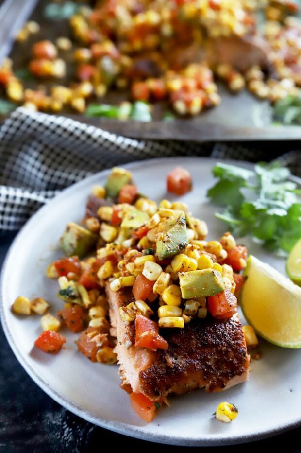 Corn salsa on top of a salmon filet