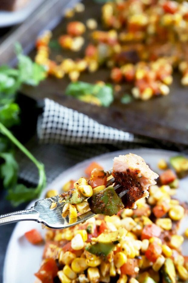 Fork full of salmon with corn salsa