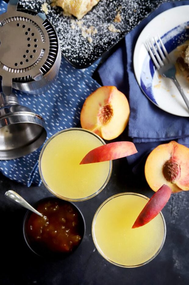 Overhead photo of peach breakfast martinis with peach slices