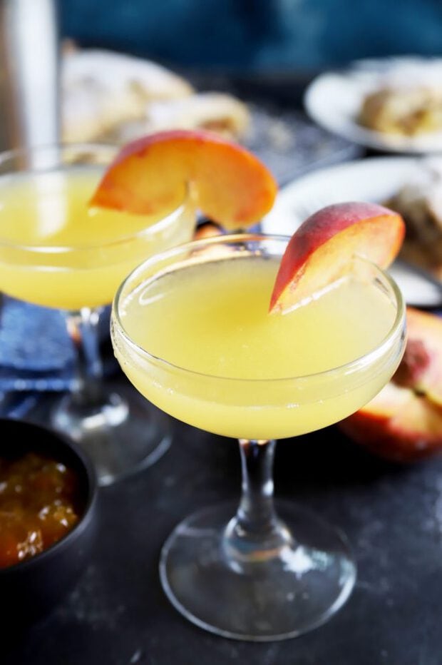 Peach breakfast martini with peach slices