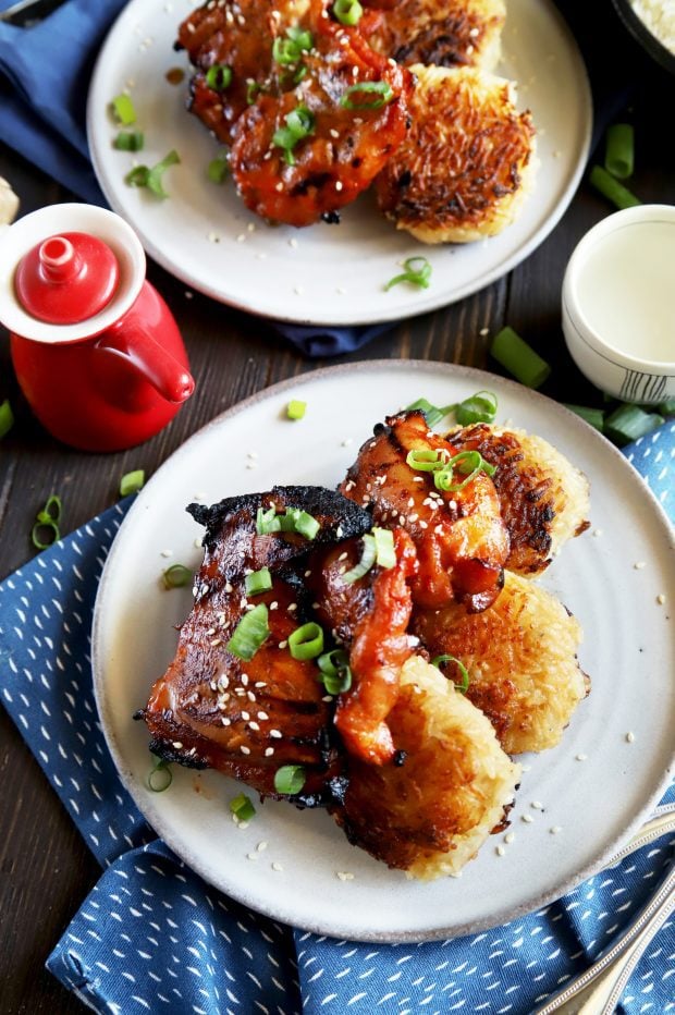 Overhead shot of Korean dinner with chicken and rice cakes