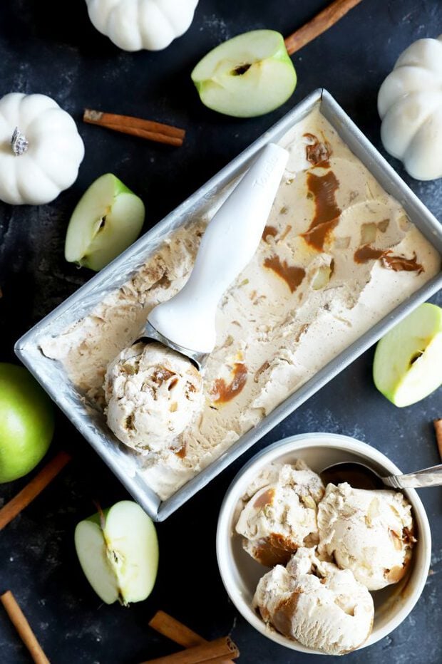 Scooping out ice cream with caramel and apple