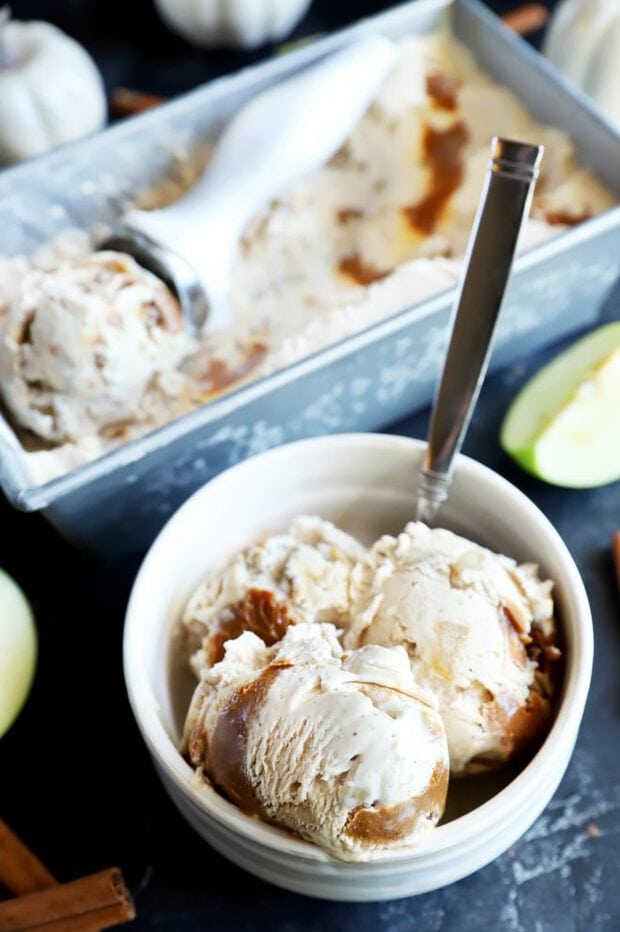 Caramel apple ice cream in a bowl with a spoon