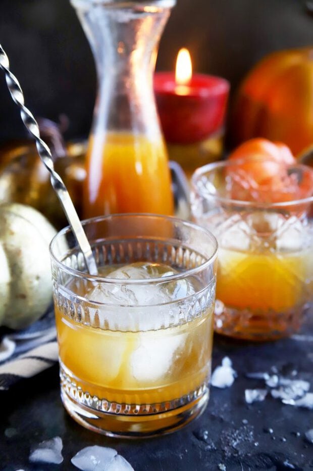 Stirring an old fashioned cocktail for fall