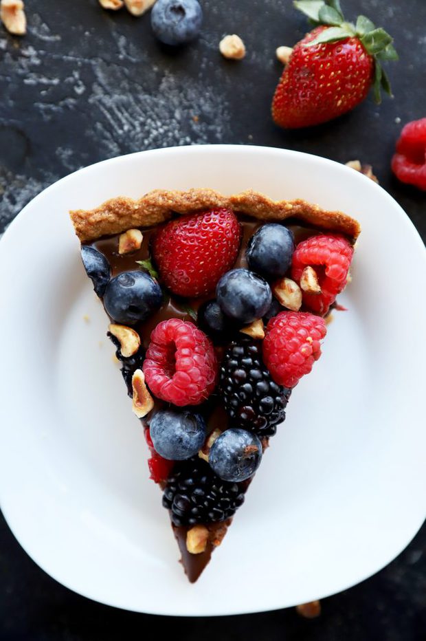 One slice of chocolate tart with hazelnut crust