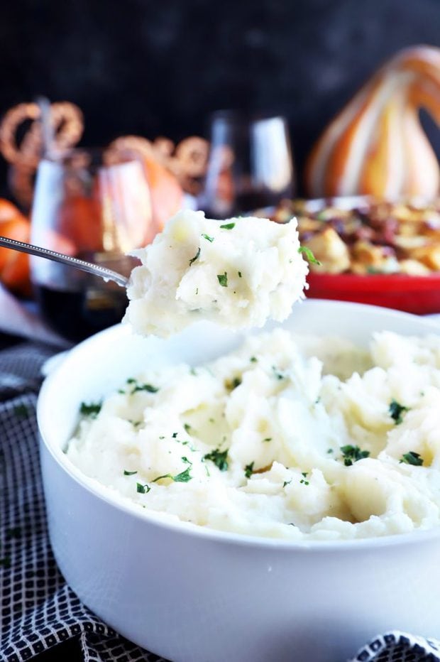 Spooning out mashed potatoes