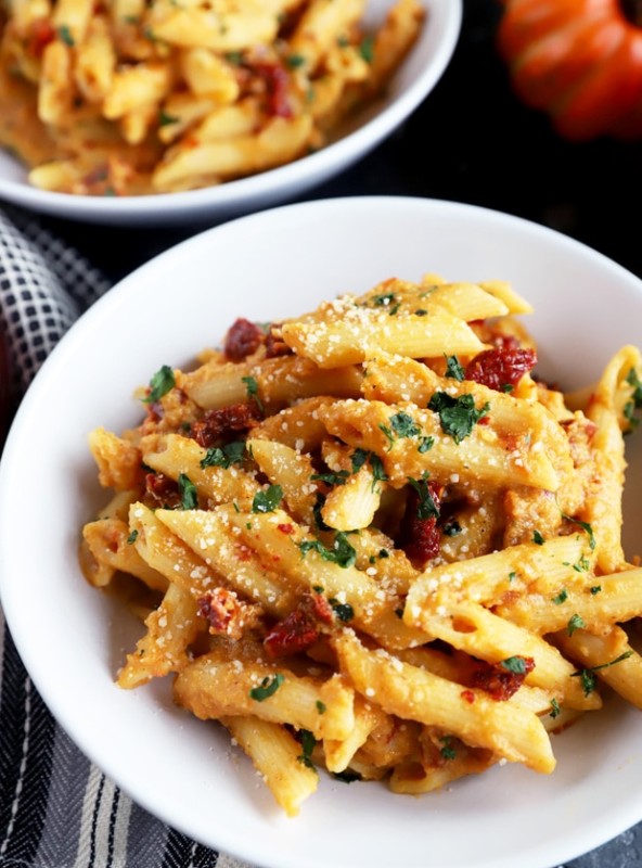 Bowl full of pumpkin pasta with sun-dried tomatoes