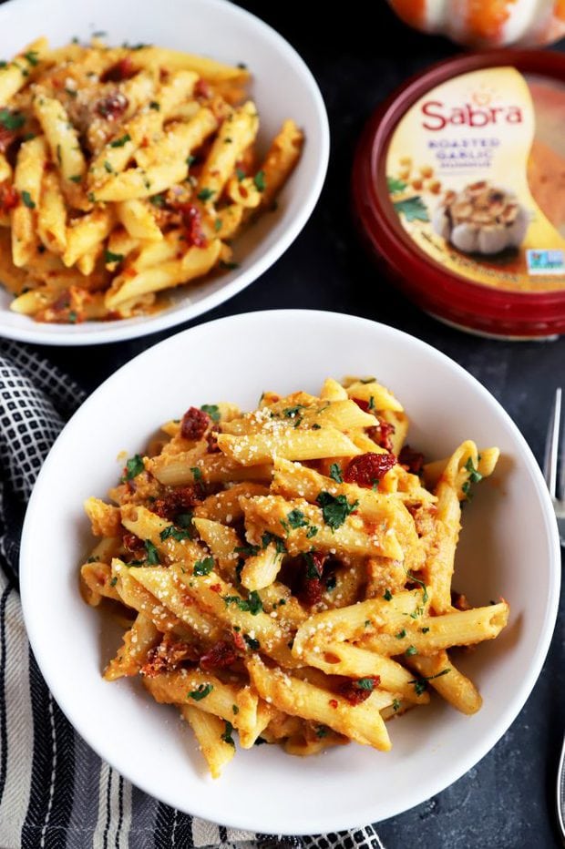 Bowl of pasta with pumpkin and hummus